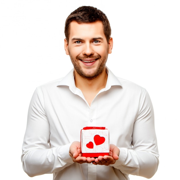 Young man carrying heart shaped box