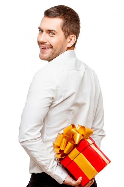 Young man carrying heart shaped box