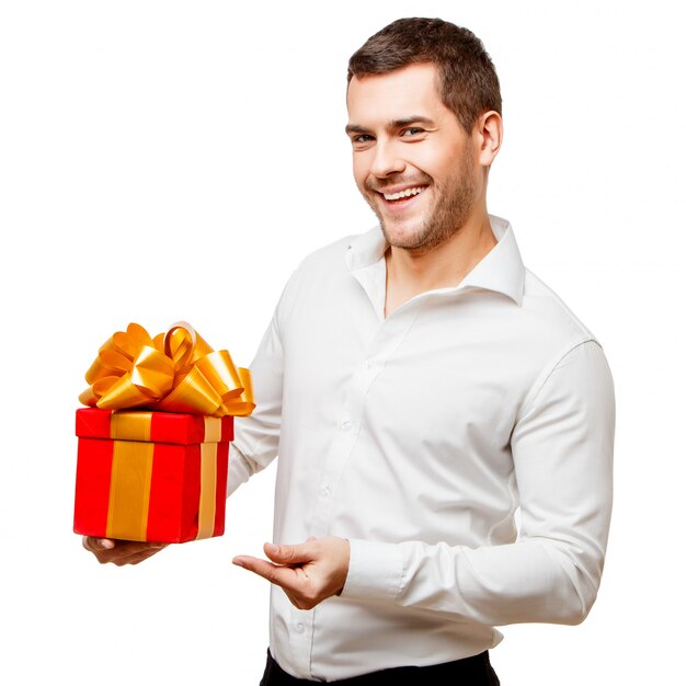 Young man carrying heart shaped box