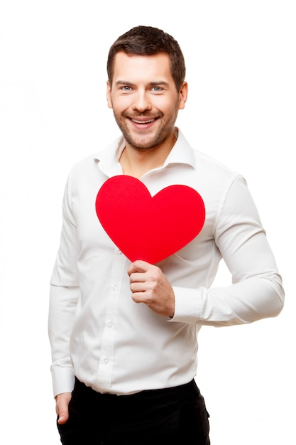 Young man carrying heart shaped red card