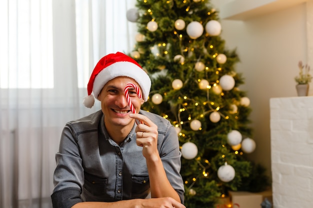 Young man celebrating Christmas in kitchen