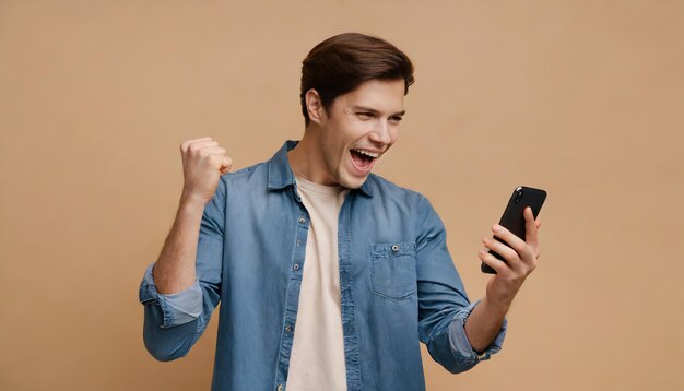 Young Man Celebrating Success with Smartphone