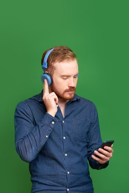 Young man choosing music