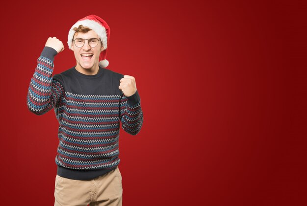 Young man at Christmas doing gestures