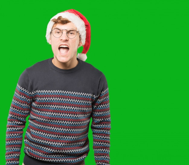 Photo young man at christmas doing gestures