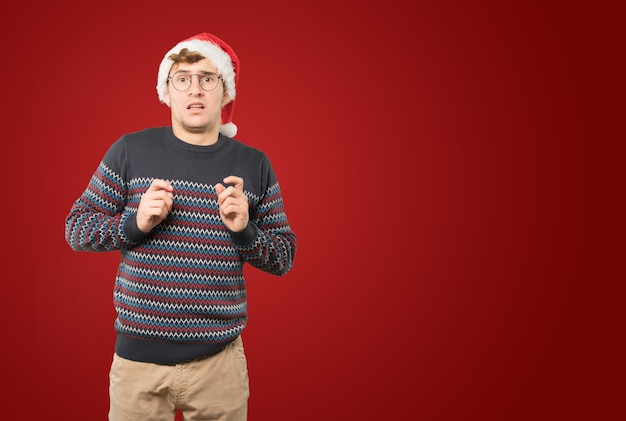 Young man at Christmas doing gestures