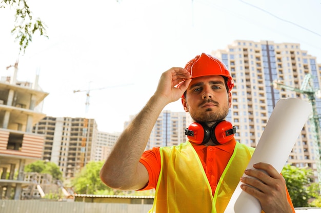 Young man civil engineer in safety hat