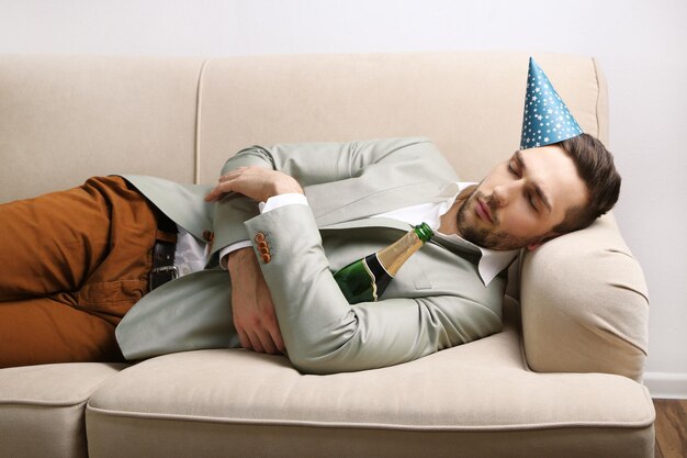 Young man on couch after fun close up