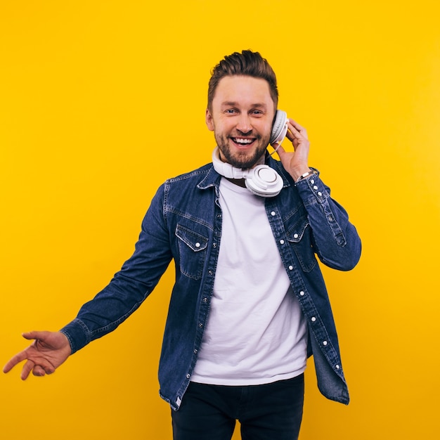 Young man dancing and listening music