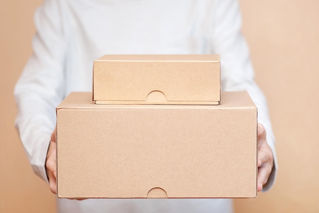 Young man delivering boxes from an online store