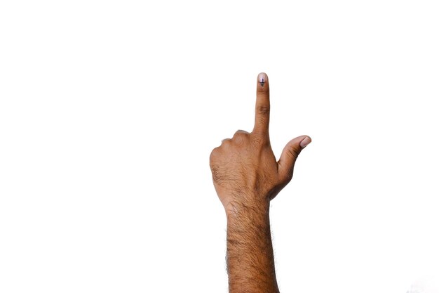 Photo young man displays his inked fingertips after casting his vote