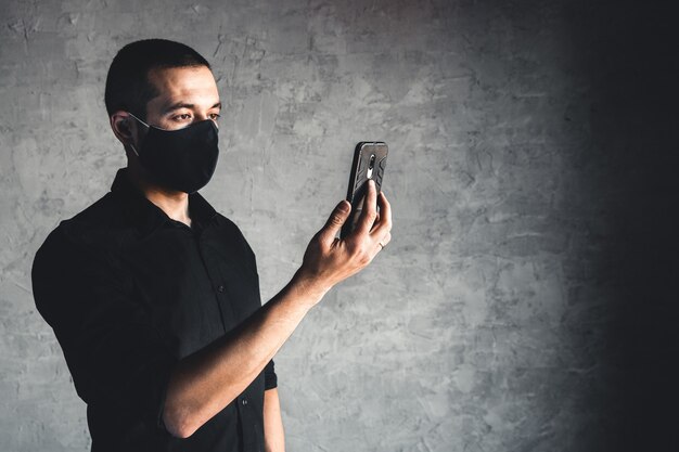 young man in disposable face mask