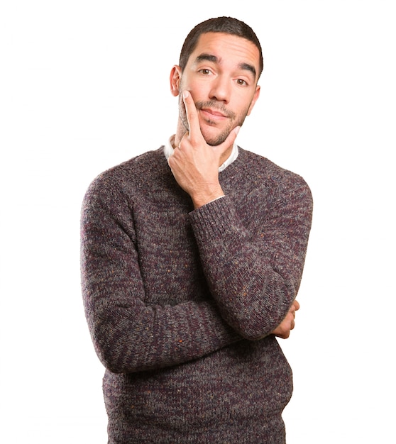 Young man doing a doubt gesture