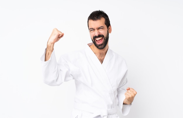 Young man doing karate celebrating a victory