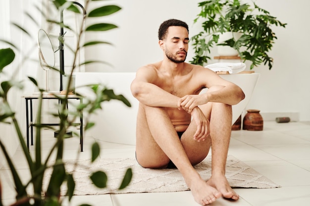 Young man doing relaxation exercise