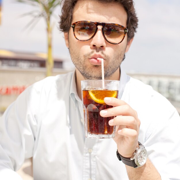 Young man drinking a beverage