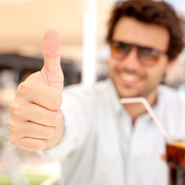 Young man drinking a beverage