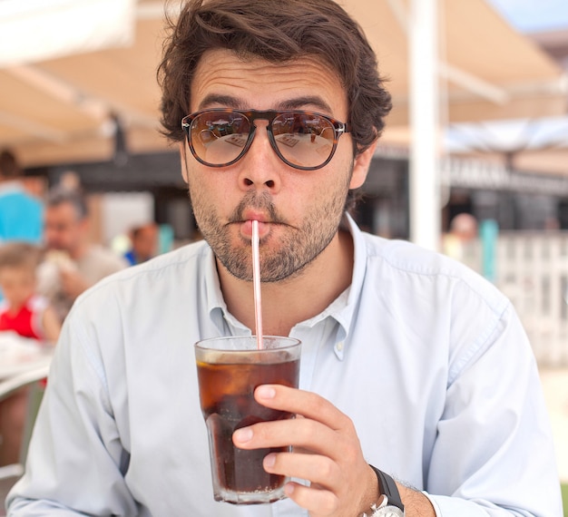 Young man drinking a beverage