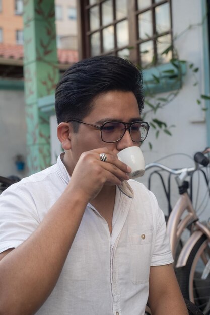 young man drinking caffe