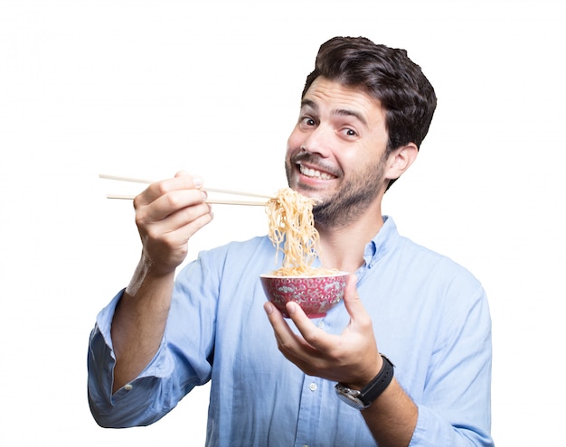 Premium Photo | Young man eating sushi on white background