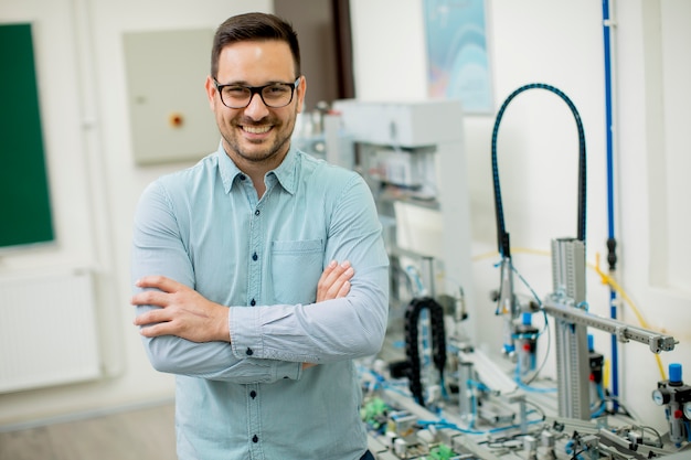 Young man in the electronic workshop