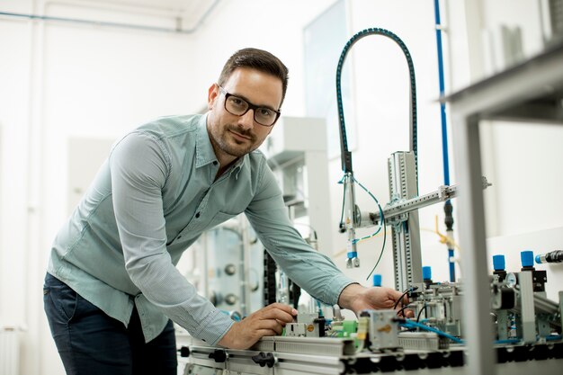 Young man in the electronic workshop