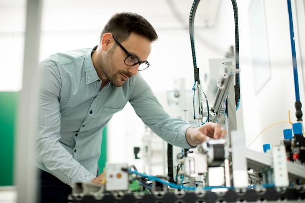 Young man in the electronic workshop