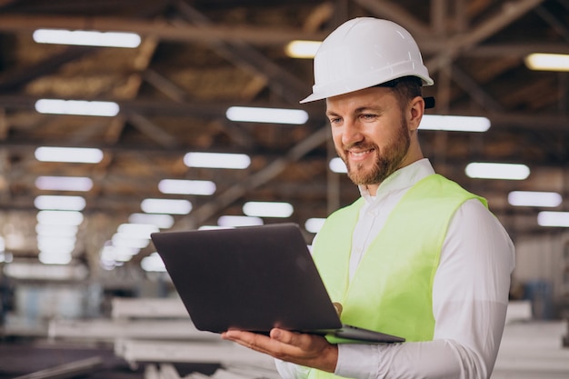 Young man engineer working on factory