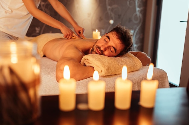 Young man enjoying a massage at a spa