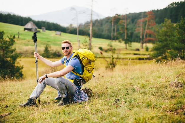 Young man enjoys hiking on a sunny day