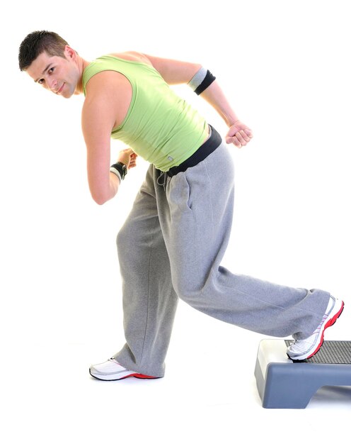 young man exercise fitness sport and strech isolated on white in studio