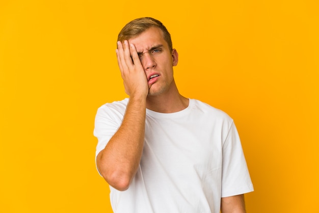 Young man expressing emotions isolated