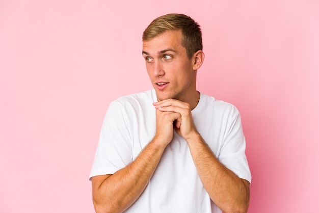 Young man expressing emotions isolated