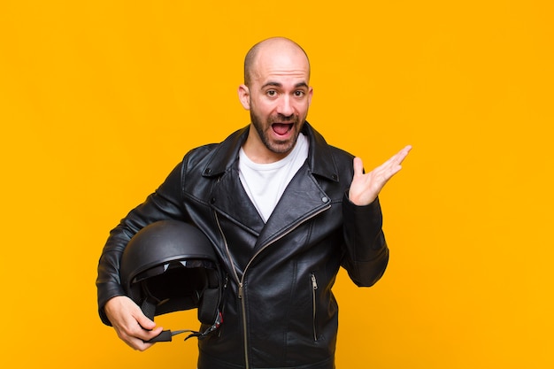 Young man feeling happy, surprised and cheerful