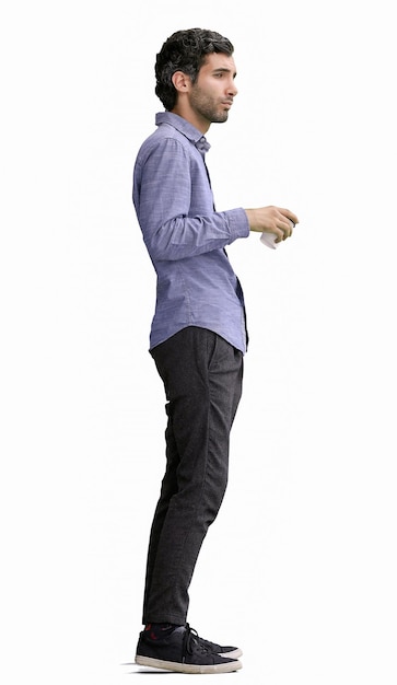 young man in full growth isolated on white background holding a mug of coffee