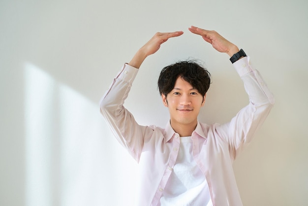 Young man giving an ok hand sign