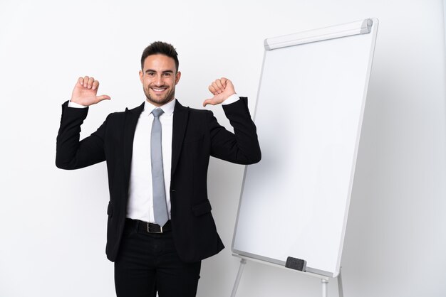 Young man giving a presentation on white board and proud