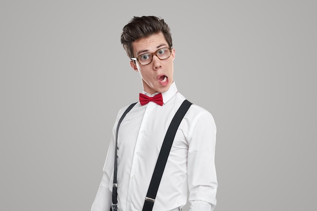 Young man in glasses making silly face