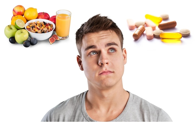 Young man in grey shirt on food background