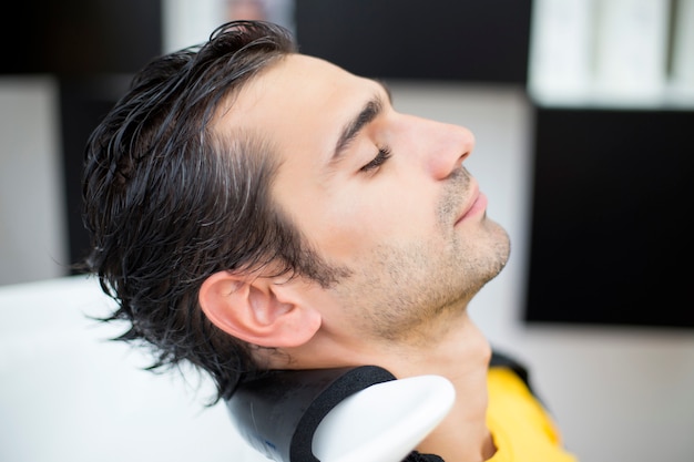 Young man at hairdresser