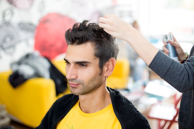 Young man at hairdresser