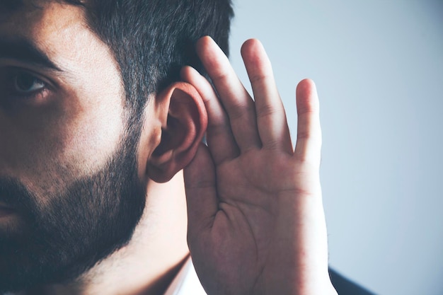 Young man hand on the ear