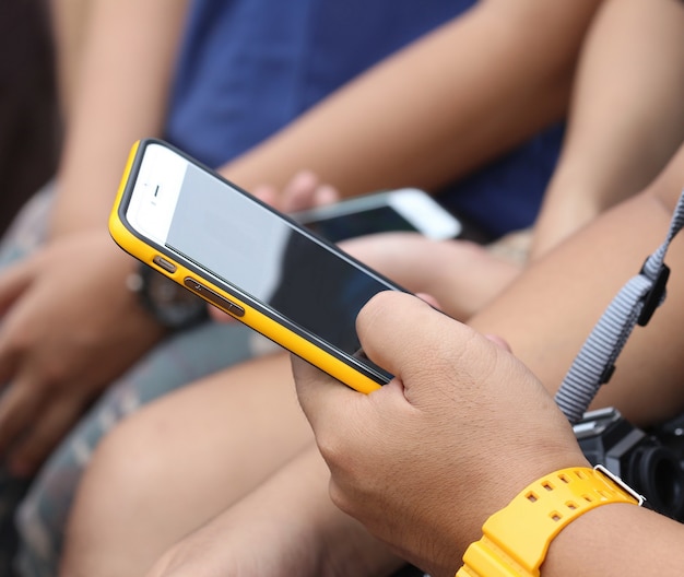 Young man hand hold phone