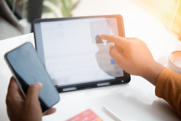 young man hands using tablet