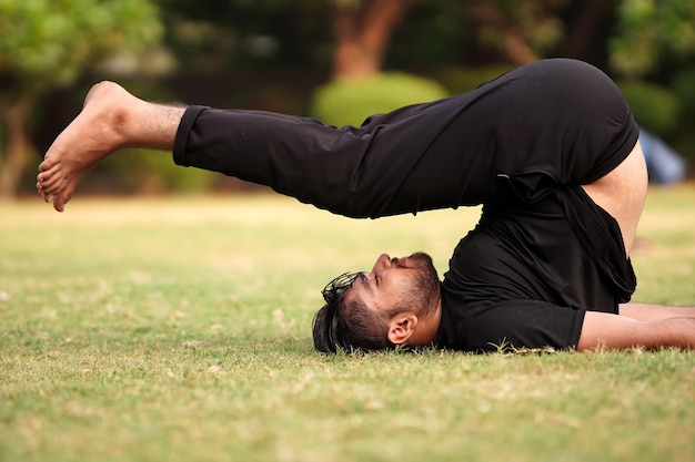 Young man in handstand exercise