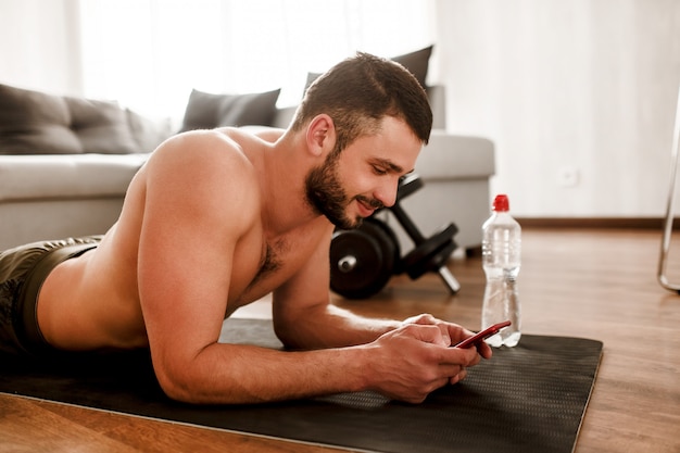 Young man having a break after working out