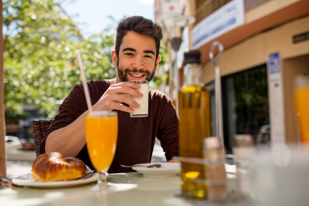 Young man having a breakfast