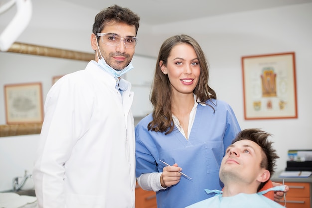 Young man having dental chekup at dentist office