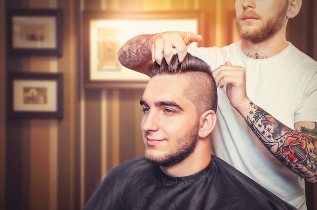 Young man having hair dress