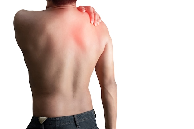 Young man holding back pain bone spine on a white surface